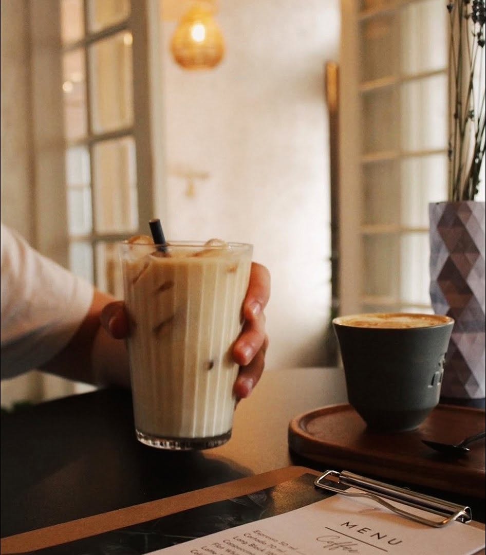 Coffee enjoyed in the warm Erbario interior
