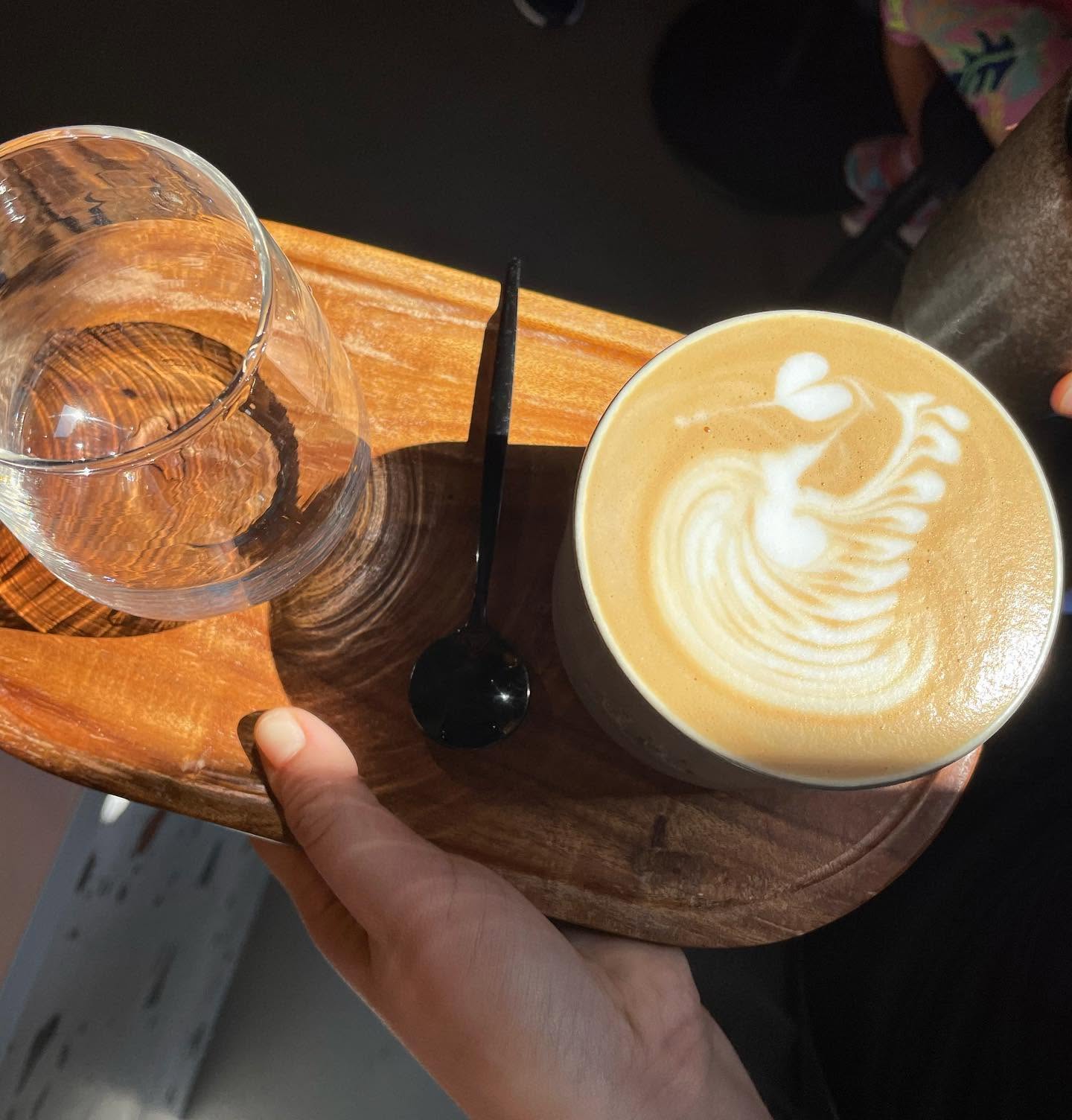 Specialty coffee served on a wooden tray